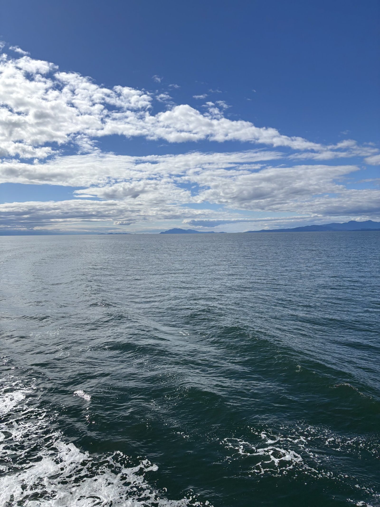 Open water on Baynes Sound under a summer sky