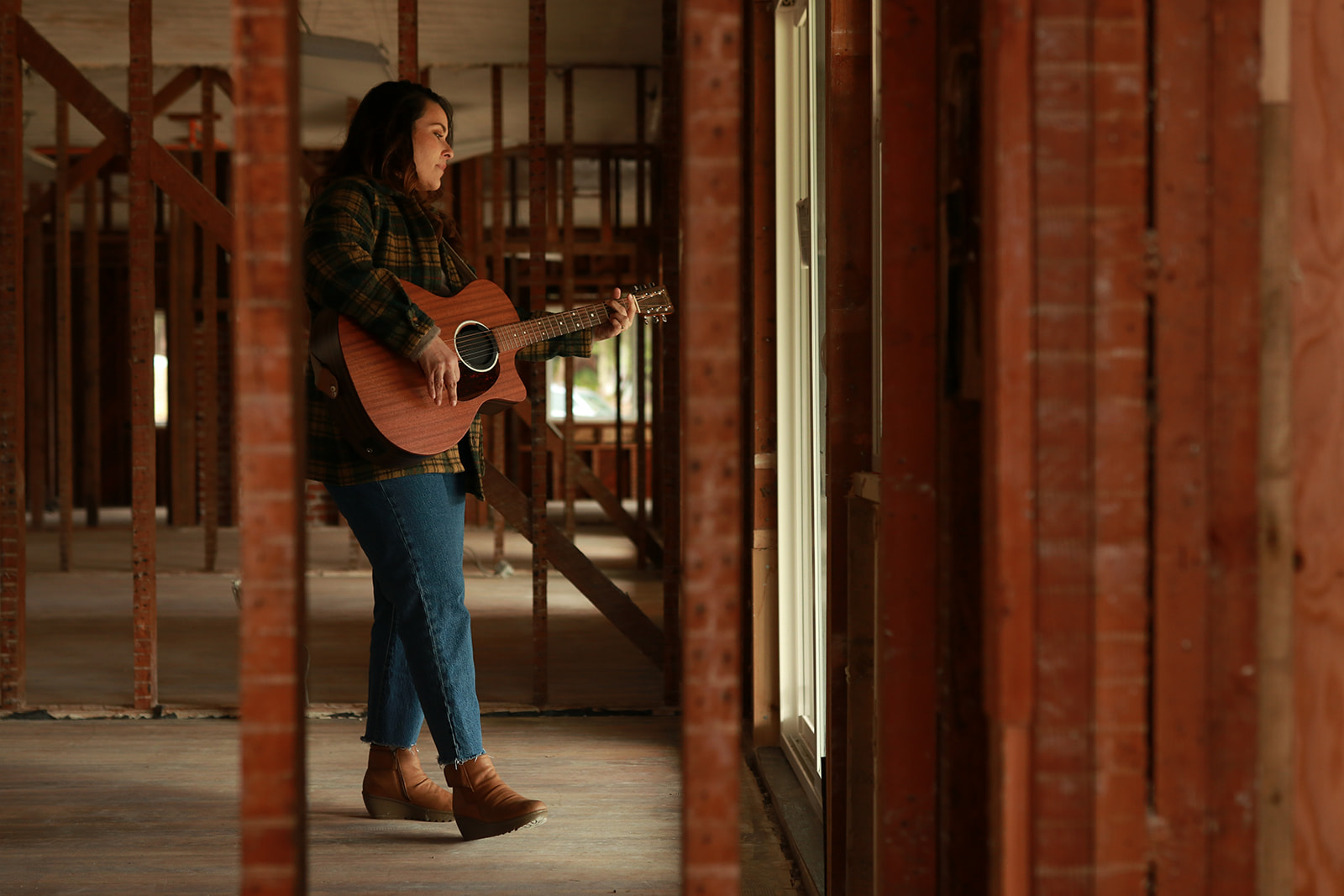 A musician playing guitar inside the historic building
